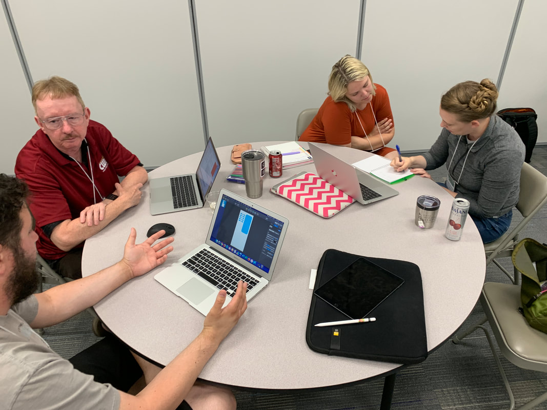 Photo of teachers working at one of the Community Engagement Initiative Coding Academies in the summer of 2019